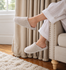 files/Cozy_Beige_Slippers_by_the_Window.png